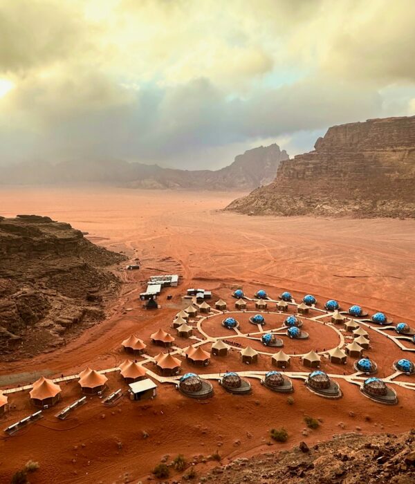 sunset, hotel, and desert in Wadi Rum Village, Jordan
