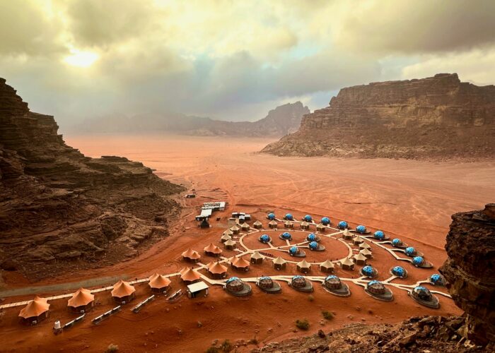 sunset, hotel, and desert in Wadi Rum Village, Jordan
